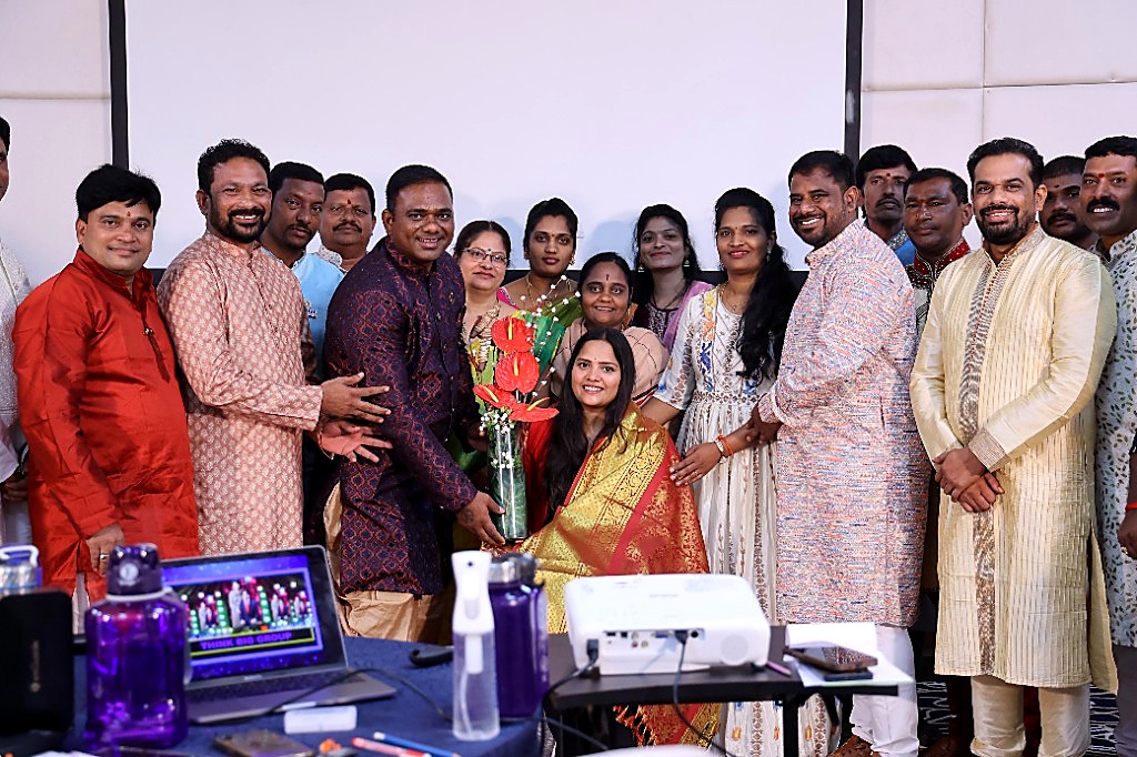 Business Owners Honoring Deepthi with Flowers and Royal Shawl